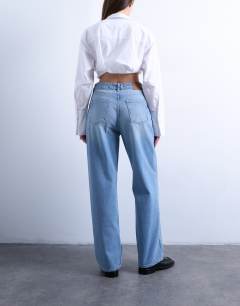 Model wearing Mid rise loose fit straight jean in bleach