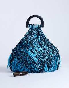 Model wearing Hugo weave tassel straw bag in blue & black