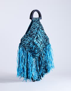 Model wearing Hugo weave tassel straw bag in blue & black