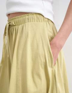 Model wearing Hybrid balloon maxi skirt in khaki