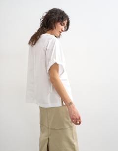 Model wearing Hybrid tie sleeve tee in white