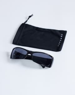 Model wearing Ibiza wrapround rectangle sunglasses in black