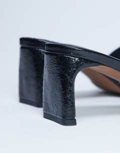 Model wearing Idea patent square toe mule in black