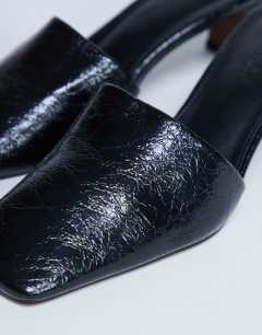Model wearing Idea patent square toe mule in black
