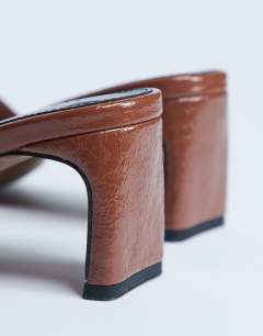 Model wearing Idea patent square toe mule in chocolate