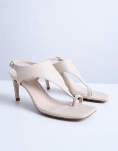 Iman toe loop heeled sandal in off white