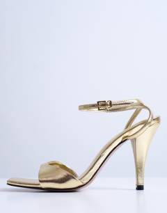 Model wearing Immy cone heel sandal in gold