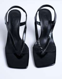 Model wearing Indie wedge sandal in black