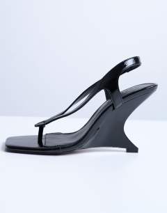 Model wearing Indie wedge sandal in black