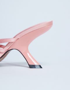 Model wearing Indigo strappy angled heel mule in peach