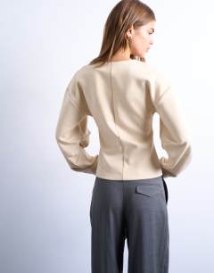 Model wearing Interlock cinch banana sleeve sweat in ecru