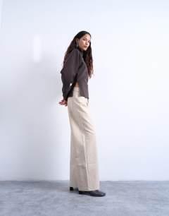 Model wearing Interlock cinch waist long sleeve funnel neck top in chocolate