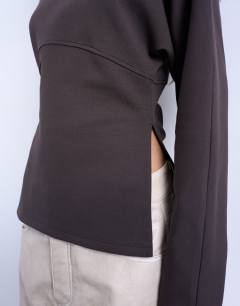 Model wearing Interlock cinch waist long sleeve funnel neck top in chocolate