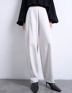 Model wearing Interlock clean barrel jogger co-ord in stone