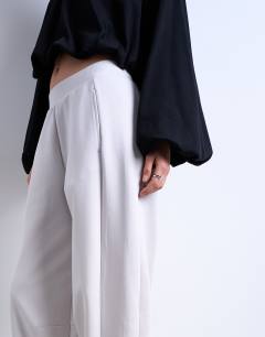 Model wearing Interlock clean barrel jogger co-ord in stone