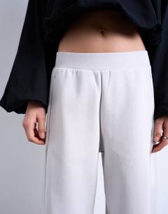 Model wearing Interlock clean barrel jogger co-ord in stone