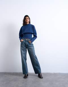 Model wearing Interlock corset waist long sleeve top in navy