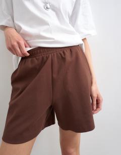 Model wearing Interlock jogger shorts co-ord in chocolate brown