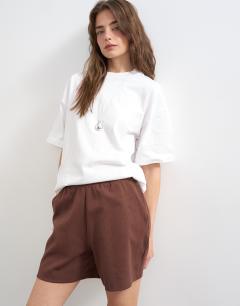 Model wearing Interlock jogger shorts co-ord in chocolate brown