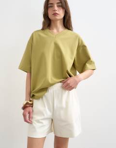 Model wearing Interlock jogger shorts co-ord in ecru