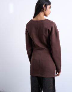 Model wearing Interlock v-neck banana sleeve tunic top in chocolate