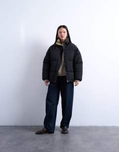 Model wearing Internal check puffer jacket in black
