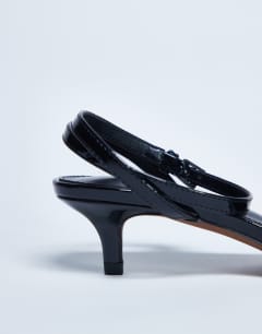 Model wearing Irene barely there mid heeled sandal in black