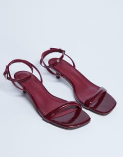 Model wearing Irene barely there mid heeled sandal in burgundy