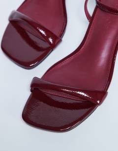 Model wearing Irene barely there mid heeled sandal in burgundy