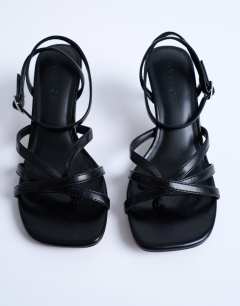 Model wearing Iris slanted heel sandal in black