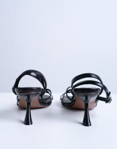 Model wearing Iris slanted heel sandal in black