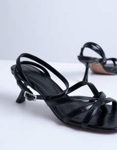 Model wearing Iris slanted heel sandal in black