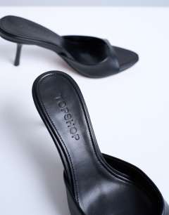 Model wearing Isaac point toe mule in black