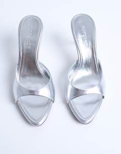 Model wearing Isaac point toe mule in silver