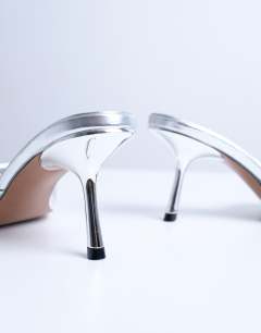 Model wearing Isaac point toe mule in silver
