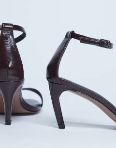 Model wearing Isabelle 2 part banana heel sandal in chocolate