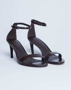 Model wearing Isabelle 2 part banana heel sandal in chocolate