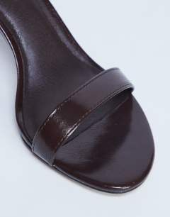 Model wearing Isabelle 2 part banana heel sandal in chocolate