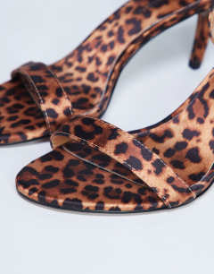 Model wearing Isabelle 2 part banana heel sandal in leopard print