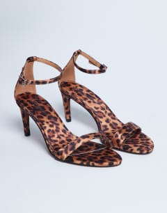 Model wearing Isabelle 2 part banana heel sandal in leopard print