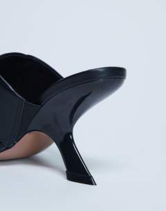 Model wearing Isai beaded toe thong heeled mule in black