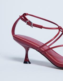 Model wearing Itzia strappy mid heel sandal in red