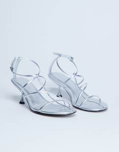 Model wearing Itzia strappy mid heel sandal in silver