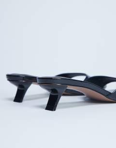 Model wearing Ivee kitten heel mule in black