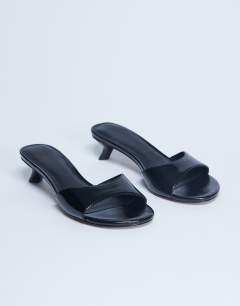 Model wearing Ivee kitten heel mule in black