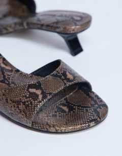 Model wearing Ivee kitten heel mule in natural snake