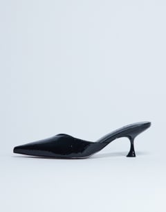 Model wearing Ivette croc patent close toe mule in black