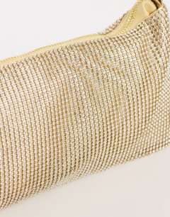 Model wearing Jackie small diamante shoulder bag in gold