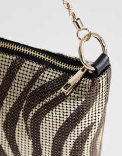 Model wearing Jackson embellished small shoulder bag in chocolate & silver zebra