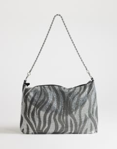 Model wearing Jackson embellished small shoulder bag in silver & grey tiger